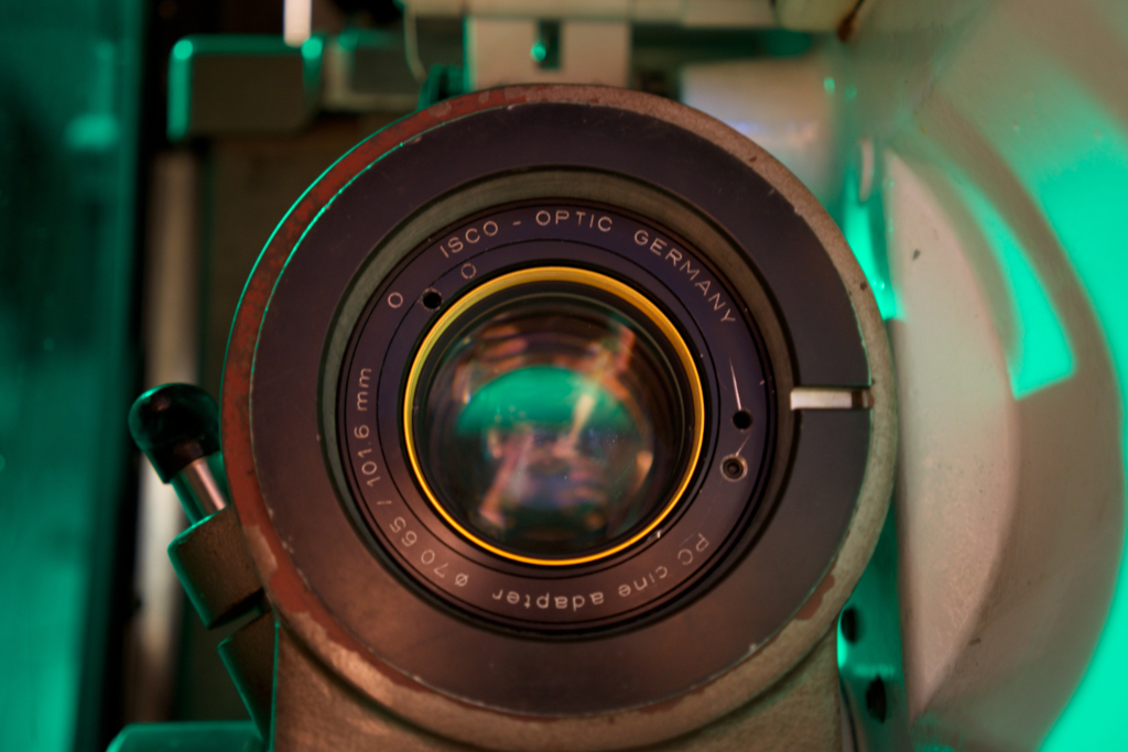 A 70mm lens mounted in one of the Norelco DP70 projectors